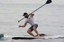 LIAM HEMSWORTH SPOTTED PADDLEBOARDING IN MALIBU