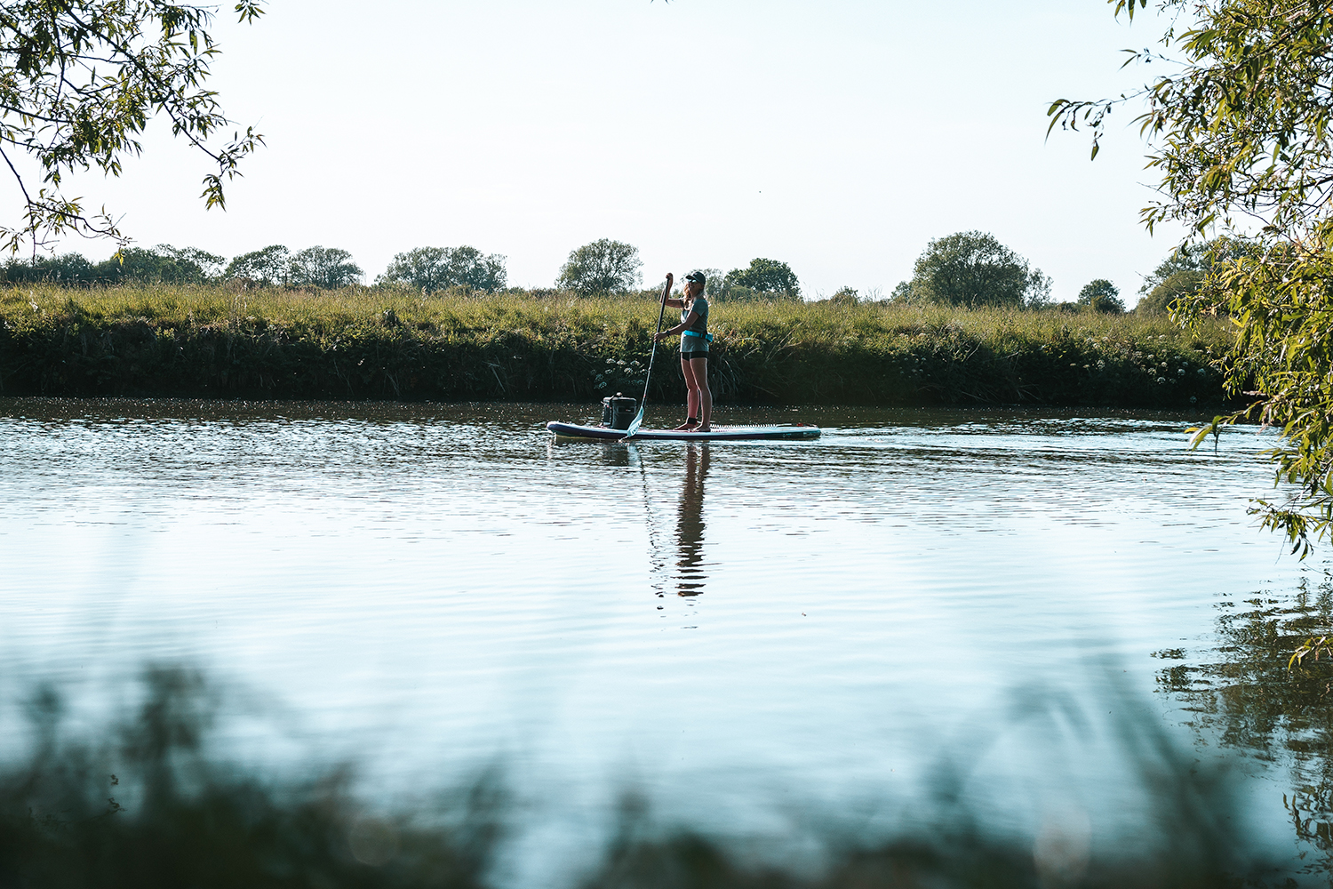 Ellie cruisng on the SUP