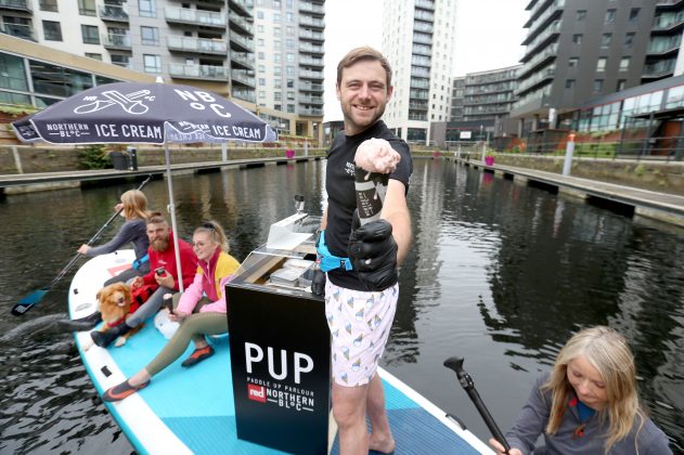 Picture : Lorne Campbell / Guzelian

Paddleboard enthusiasts  get an ice-cream from Josh Lee, co-founder of urban ice cream brand, Northern Bloc at the launch of the world's first paddle board ice-cream parlour, in Leeds, on Wednesday morning.
Celebrating the start of National Ice Cream Month (1 July) the brand has teamed up with Red Paddle Co to seek the most carbon-friendly way to share its vegan ice creams whilst the sun shines. 
Trialling the PUP (Paddle Up Parlour) on its home surf, Northern Bloc is trialling its parlour ahead of its next outing at Dogmasters, 2021, the UK dog surfing and SUP championships 
PICTURE TAKEN ON WEDNESDAY 30 JUNE 2021.



FULL PRESS RELEASE BELOW

Ice Cream Float: worldÕs first paddleboard ice cream parlour makes maiden voyage for start of National Ice Cream Month 
Vegan ice cream brand trials sustainable summer vehicle on Leeds canal ahead of summer celebrations

Paddleboard enthusiasts from Leeds, Jamie Crowther and Zoe Dawson, proved theyÕve got paddleboarding licked when they took to the water today to try out the worldÕs first paddleboard ice cream parlour, created by urban ice cream brand, Northern Bloc.  

Celebrating the start of National Ice Cream Month (1 July) the brand has teamed up with Red Paddle Co to seek the most carbon-friendly way to share its vegan ice creams whilst the sun shines. 

Trialling the PUP (Paddle Up Parlour) on its home surf, Northern Bloc is planning a schedule of pop-up paddleboard ice cream parlours as the UK basks in a staycation summer and the popularity of paddleboarding hits new heights. 

The customised 17ft long XL Ride inflatable paddleboard ice cream parlour will take to the high seas in Bournemouth this month (25 July) for the UKÕs only Dog SUP Surfing Championships on Branksome Dene Chine beach. The internationally recognised event brings together lovers of dogs and the sea for a fun-packed day of surfing and paddleboarding competitions, as well as live music, food and drink.  

Red Paddle CoÕs customised  XL Ride inflatable paddleboard has been specially adapted to feature Northern BlocÕs floating ice cream parlour, complete with waterproof cooler bags keeping the range of vegan ice creams frozen and ready to be served up free of charge to passing paddleboard trade in need of refreshment. Designed specifically as a party paddleboard, it is RedÕs largest board, capable of carrying eight riders plus kit and is perfect for friends and families who want to make memories as well as waves. 

Boarders will be able to paddle up to the parlour paddleboard and sample free ice cream from Northern BlocÕs vegan mini tub collection including new Vegan Chocolate and Honeycomb, plant-based chocolate ice cream with honeycomb pieces, and new Vegan Chocolate Stracciatella, plant-based chocolate ice cream with dark chocolate flakes. 

Stand-up paddleboarding or ÔSUPÕ, which involves standing on a floating board on the water using a paddle, was dubbed the sport of 2020 and continues to grow in popularity. Board stockists and brands such as South Devon-based Red Paddle Co, report that more British people than ever have been buying SUPs since lock down began last year. 
Whilst paddleboarding has been around for some time, the recent boom has been driven by the accessibility of the sport and the fact that itÕs the perfect socially distant activity. According to the Watersports Participation Survey, together with surfboarding and bodyboarding, it recorded the highest increase in participation of all water sports, rising from 502,000 in 2008 to almost 1.4 million in 2018. 
Commenting on Northern BlockÕs SUP ice cream parlour, Jamie of East Ardsely near Leeds said: ÒThis is such a cool idea as it captures the feel of the summer and beach life perfectly and is so much fun too! As a keen paddleboarder, itÕs great to be able to try out different areas and experience new things, so it was definitely worth paddling out to the paddleboard parlour for a taste of such sensational ice cream. Uptake of the sport would be even greater than it is already if there was free Northern Bloc ice cream at the end of every paddle!Ó
Co-founder and director at Northern Bloc, Josh Lee, commented: ÒTo kick off National Ice Cream Month, we decided to take a totally different approach to sampling by creating something thatÕs totally environmentally friendly and linked to our ethical approach to making 100% plant-based premium quality ice cream. It was great to see local paddleboard enthusiasts putting the parlour to the test and jumping on board to satisfy their craving for delicious, natural ice cream.Ó

Charlie Green of Red Paddle Co added: ÒWeÕve had the craziest past 12 months with demand for our boards going through the roof globally as more and more people discover the sport but this is the icing on the cake. Turning our biggest paddleboard into a floating ice cream parlour doesnÕt happen every day and judging by the astonishing reaction itÕs received today, it will certainly be making waves throughout the rest of its summer tour.Ó
  

ENDS


For more information and interviews, please contact Julia Cross onÊpress@northern-bloc.comÊ/ 07825 758649
Ê
About Northern Bloc
At Northern Bloc we set out to create a great tasting natural ice cream. WeÕre ice cream pioneers challenging the norm and changing the game to make ice cream much more than just a summer treat. Based in our inner-city HQ in the North, we donÕt compromise and believe that you shouldn't have to either Ð whether thatÕs on flavour, ingredients, values, ethics, or anything else.
WeÕre straight talking and always stay true to the principle of using only the best natural ingredients.Ê Ice cream is both a technical science and an art. Our 4th generation ice cream scientist (and world champion no less) continues to innovate in the pursuit of perfection.
Our unique, bold flavoured ice creams are ground-breaking. Just have a scoop of our 100% plant-based ice cream and youÕll see.Ê This is Ice Cream. Done Different